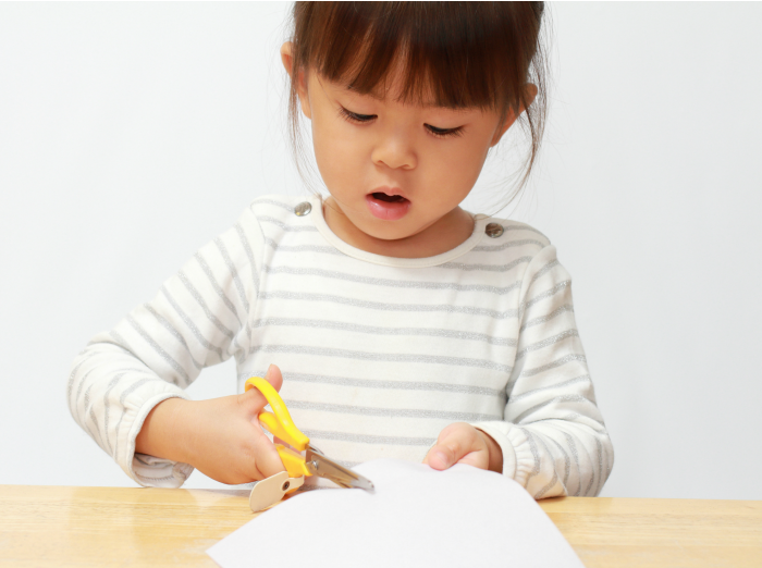 Child cutting paper