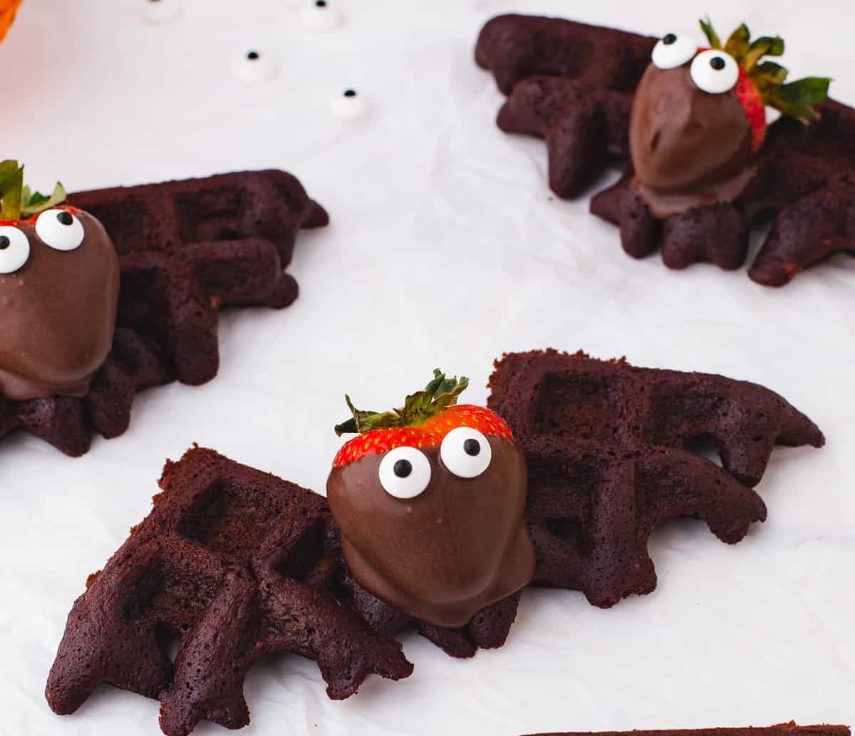 chocolate bat waffles with chocolate covered strawberry as head and candy eyeballs