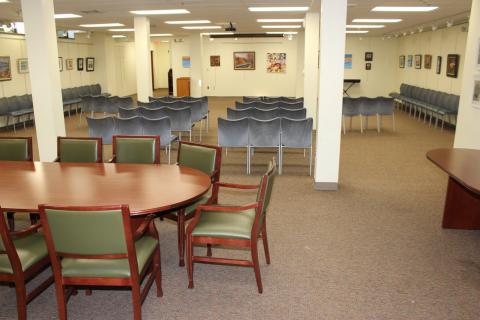 Meeting room with table and chairs.