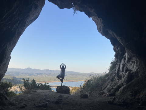 Person overseeing the Mediterranean from a cave