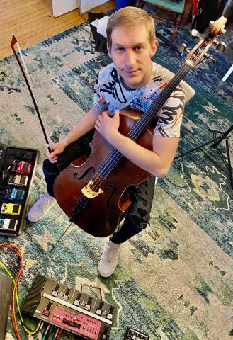 Musician Alex Prizgintas with his cello