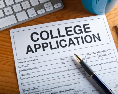 image of generic college application with a pen on top