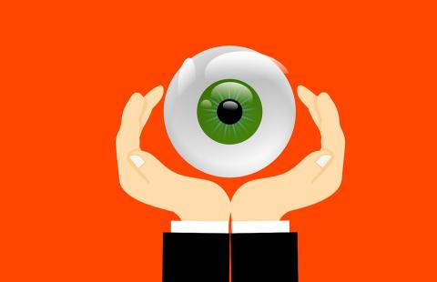 Graphic of 2 hands holding an eyeball