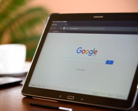 image of a laptop with web browser open to Google search