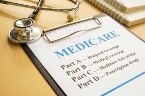 Medicare form on a clipboard with a stethoscope