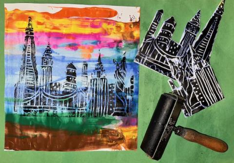 image of colorful printed NYC skyline and brayer roller used for printing