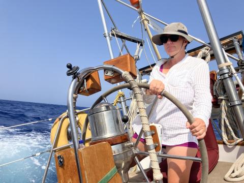 Nicole driving a sailboat
