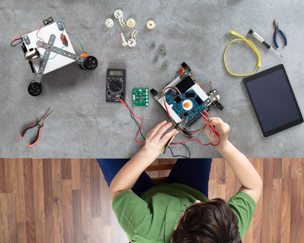 child working with robotics