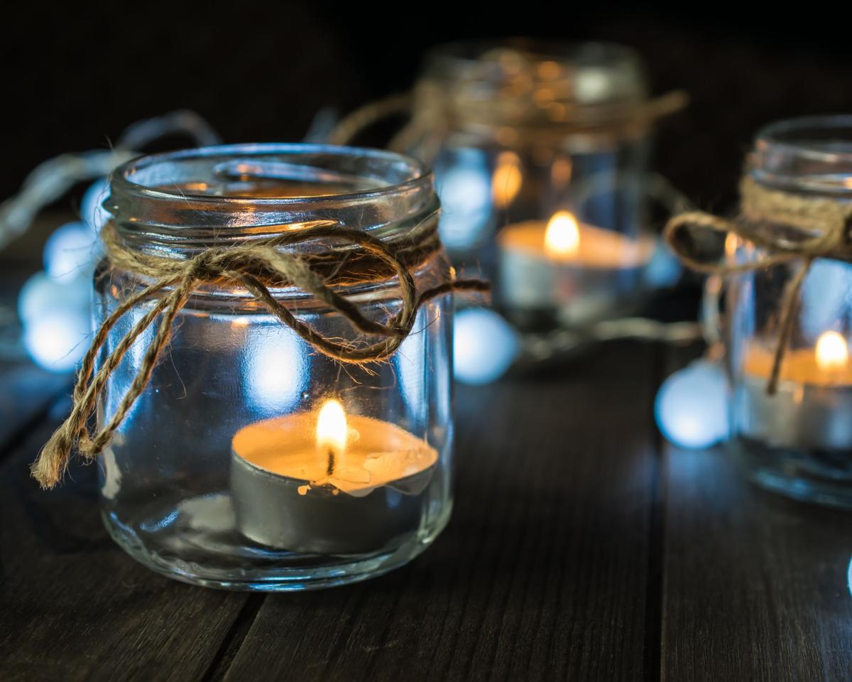 jar with tea light candle lit inside