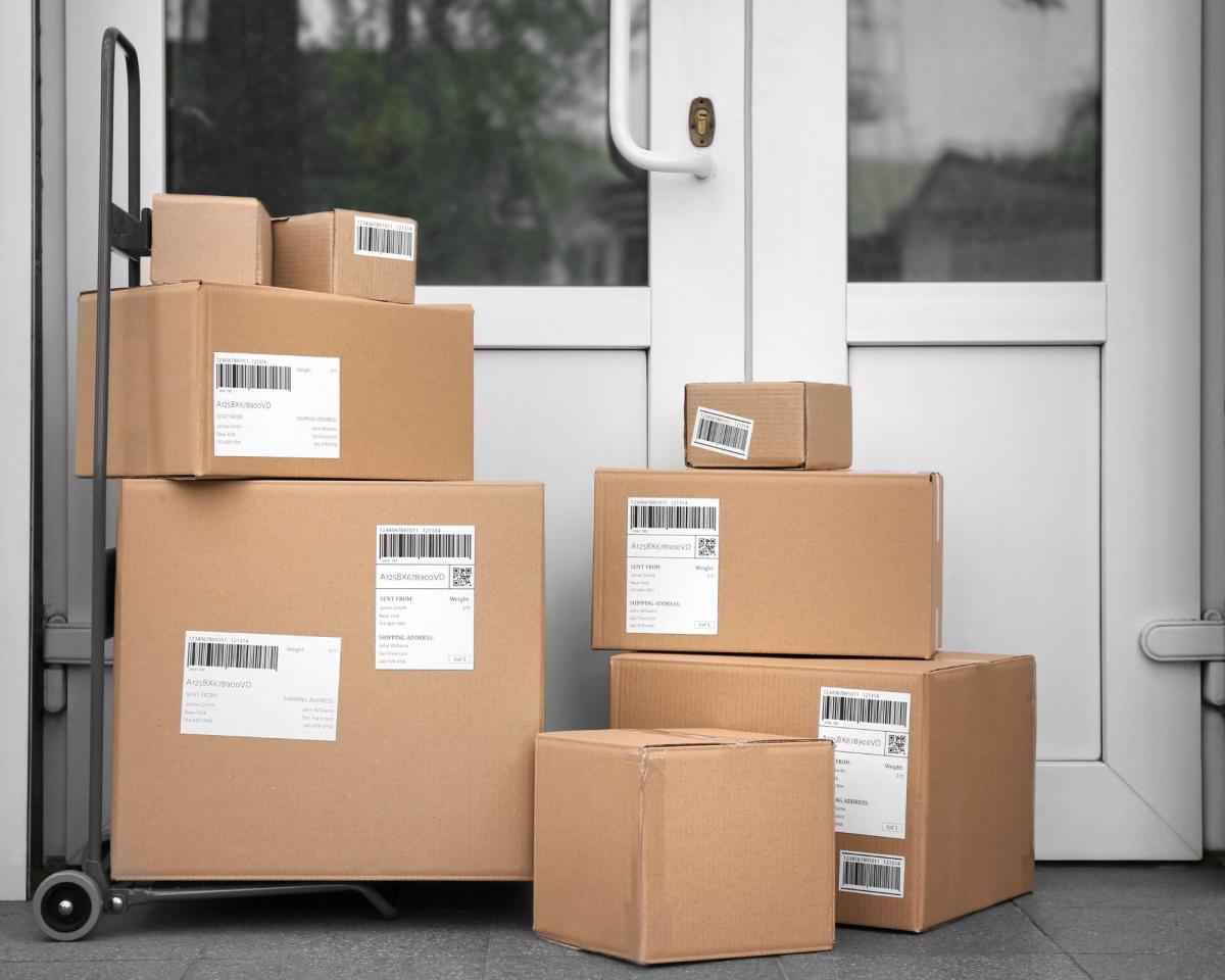 stacked packages in front of a door