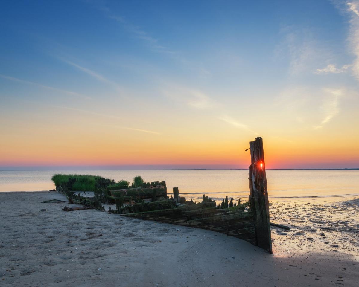 nj shipwreck with sunset