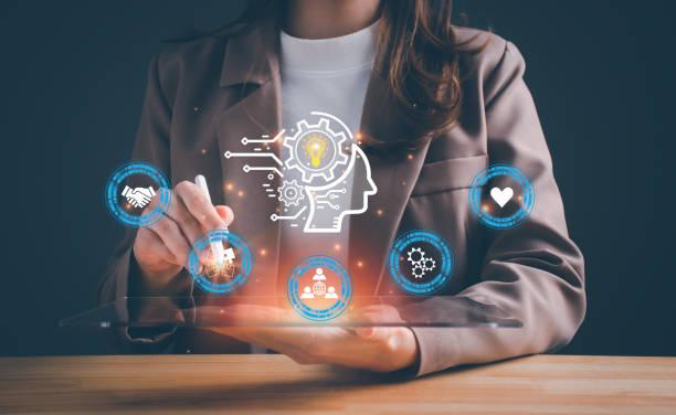 Woman holding illuminated symbols