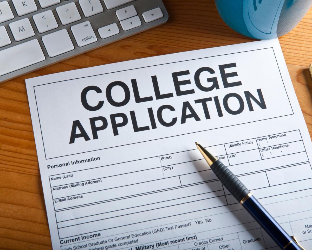 image of generic college application with a pen on top