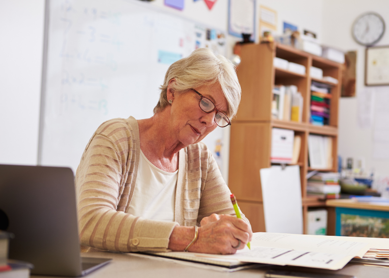 Senior at desk