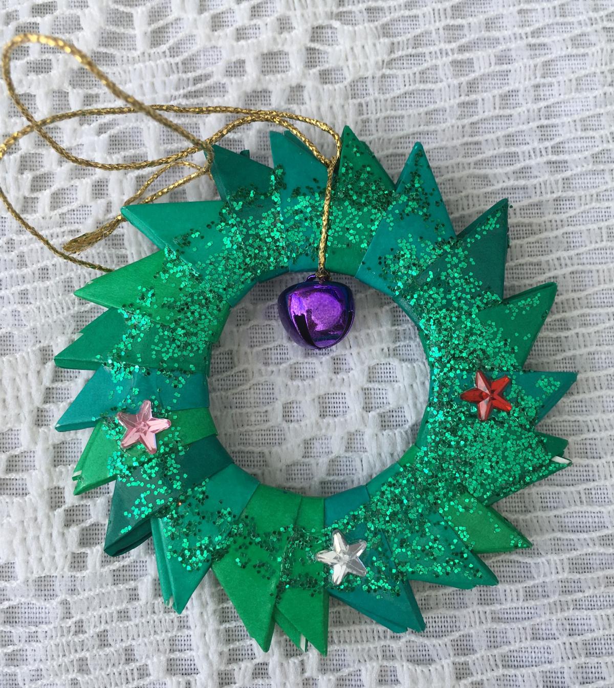 image of holiday wreath made of origami paper