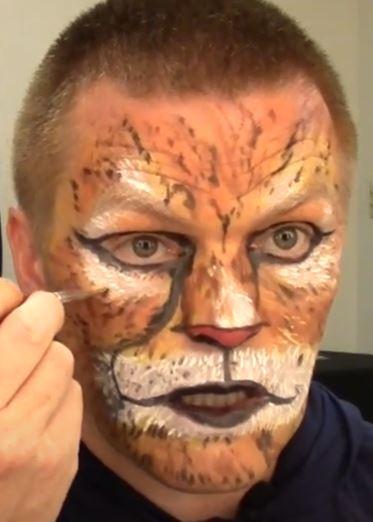 image of man with cat makeup on face